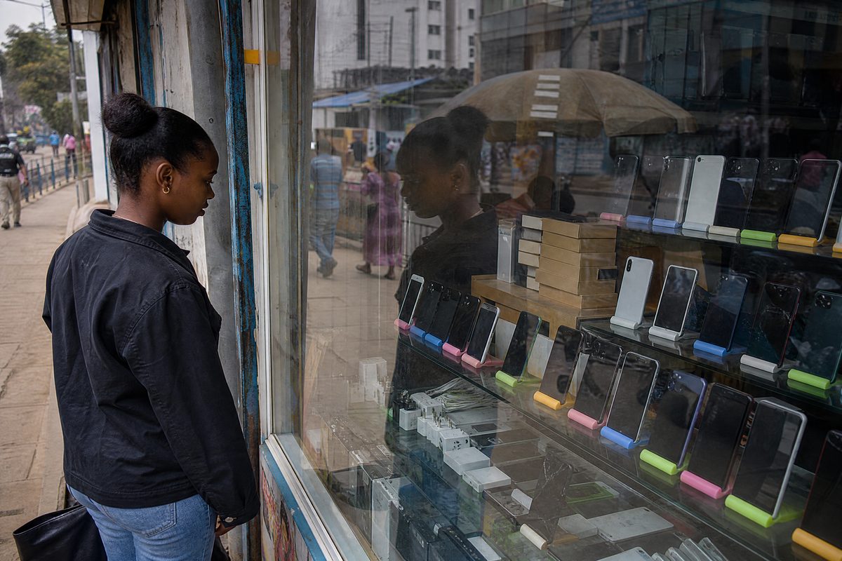 Electronics shop window, phones behind glass
